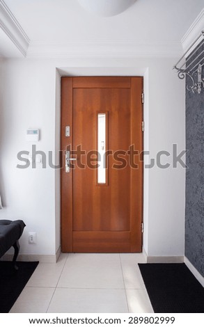 Wooden front door in luxury detached house