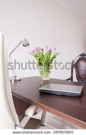 Laptop on the desk in designed home office