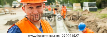 Construction worker is content because of his job