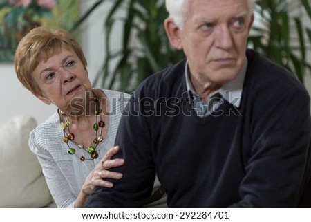 Wife trying to talk with her resentful husband