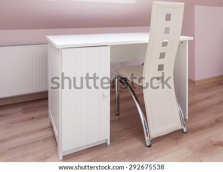 White desk and designed chair in study room