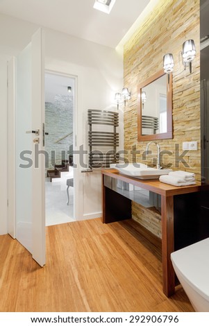 Brown exclusive bathroom in modern detached house
