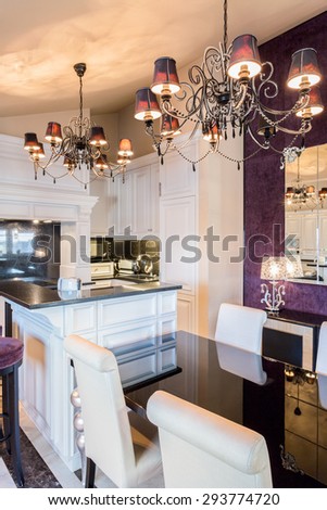 Kitchen connected with dining room in baroque house