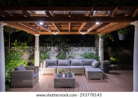 Picture of arbour with comfortable garden furniture