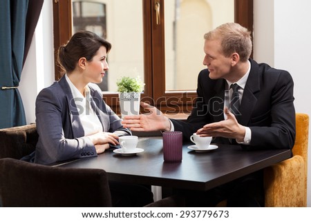 Horizontal view of business meeting in cafe