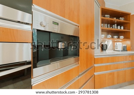 Close-up of wooden kitchen unit with coffeemaker