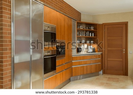 Wooden kitchen unit in beauty luxury kitchen