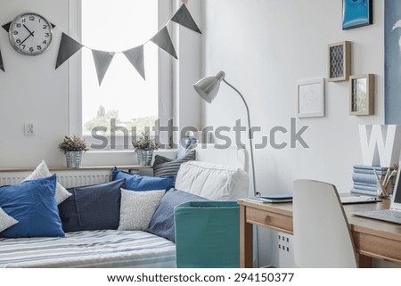 Interior of white and blue teen room