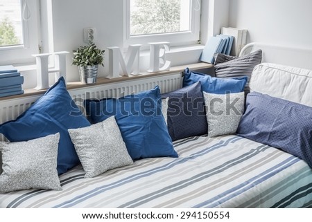 White and blue bedding set on the bed