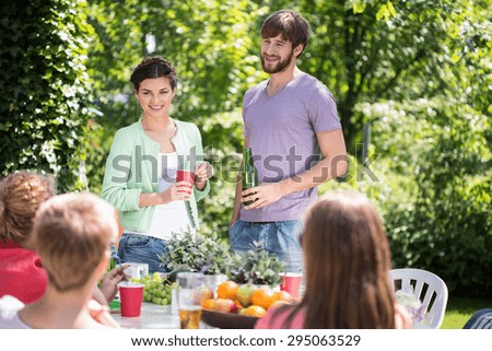 Friends having garden party at summer time