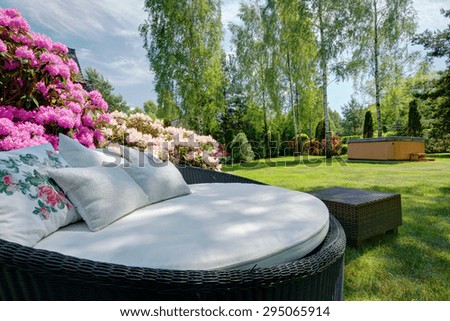 Close-up of stylish sofa in the garden