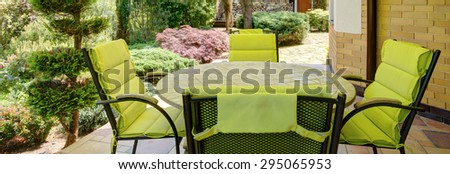 Panorama of stylish verandah with garden furniture
