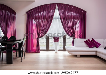 Window with rose curtains in modern interior