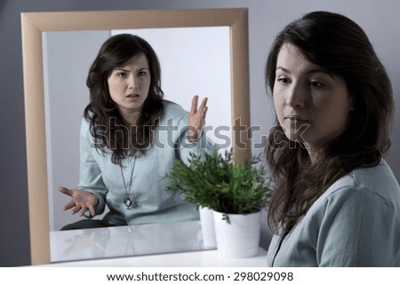 Calm young woman suppressing her anger inside her