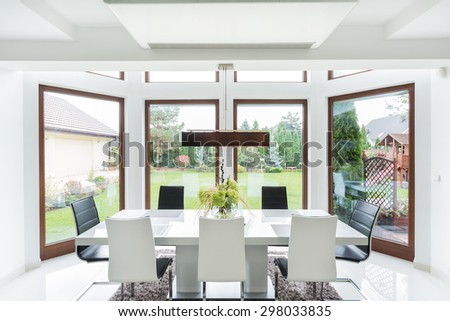 Spacious dining room interior with big window