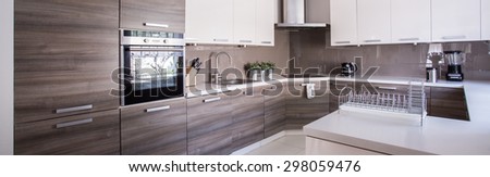 Close-up of wooden cupboards in cozy kitchen