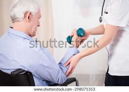 Medical assistance for an elderly person in a wheelchair