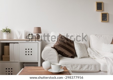 White couch and commode in drawing room