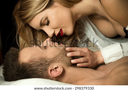 Woman in red lips kissing her lover