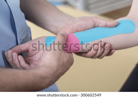 Close-up of kinesiology taping after wrist injury
