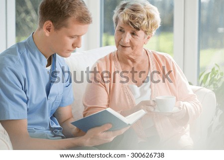 Happy older woman spending time with young man