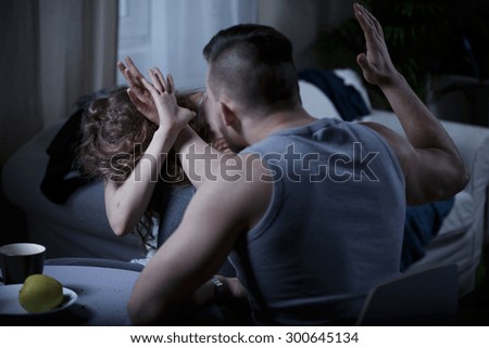 Violence at home - aggressive man beating his wife