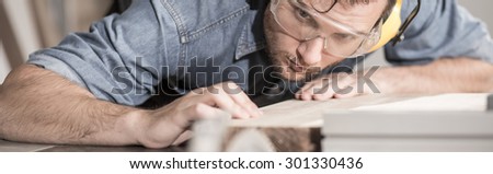Young carpenter is very neat and precise