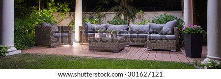 Panoramic view of garden patio with furniture