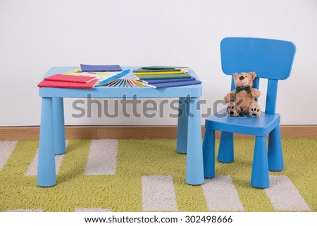 Child\'s space for study with small blue furniture