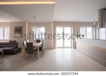 Dining space arranged in commodious modern furnished house