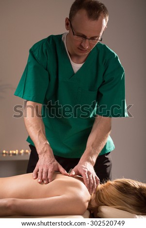 Woman during visit in luxurious massage parlor