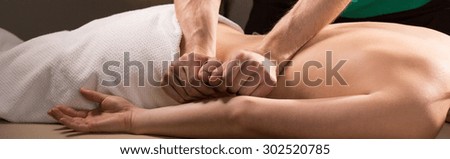 Panoramic photo of therapeutic back massage treatment