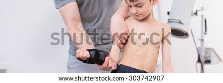 Close-up of little boy in physiotherapist's office - panorama