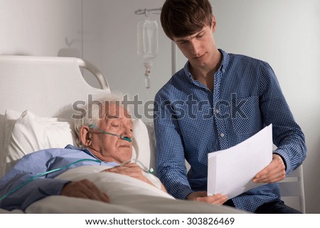 Patient and grandson looking at medical records