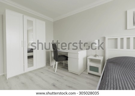 Image of bedroom interior with big closet and desk