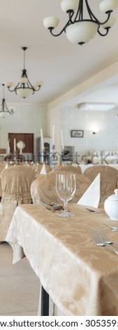 Tableware in hotel dining room set for guest