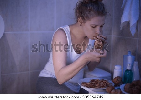 Photo of girl with bulimia can not control her hunger