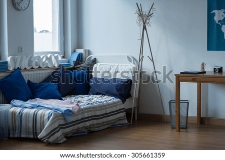 Interior of messy room of single man