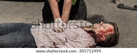 Policeman is doing first aid unconscious man