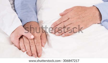 Close-up of nurse caring about ill man