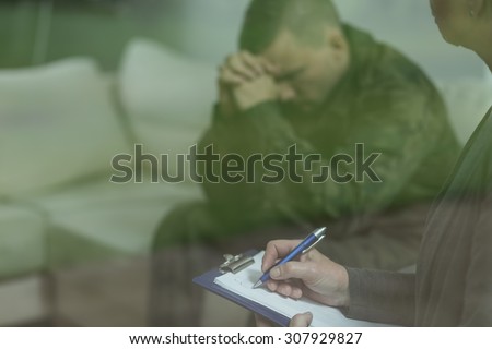 Depressed glum soldier during therapy of depression