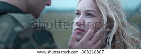 Young soldier is leaving his girlfriend