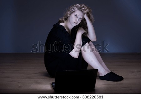 Photo of despair woman humiliated by cyber bully