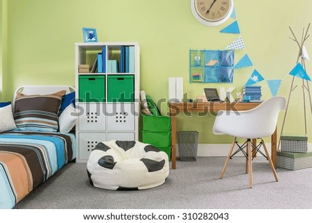 Picture of functional stylish furniture in new child room