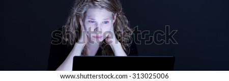 Despair sad girl looking at computer\'s screen