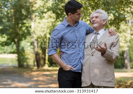 Photo of rich elderly male and his private carer