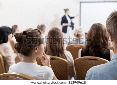 Image of speech with slideshow during symposium