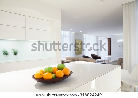 Bowl of citrus on white kitchen worktop