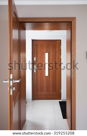 Close up of brown classic wooden doors in luxury apartment