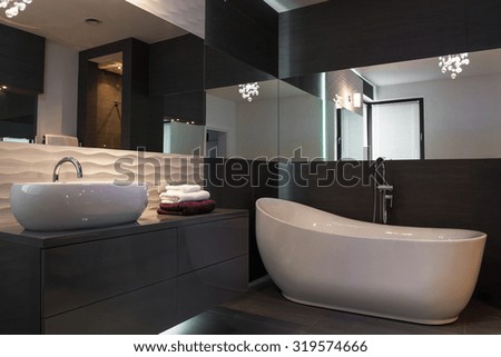 Picture of elegant fixture in luxurious dark bathroom interior